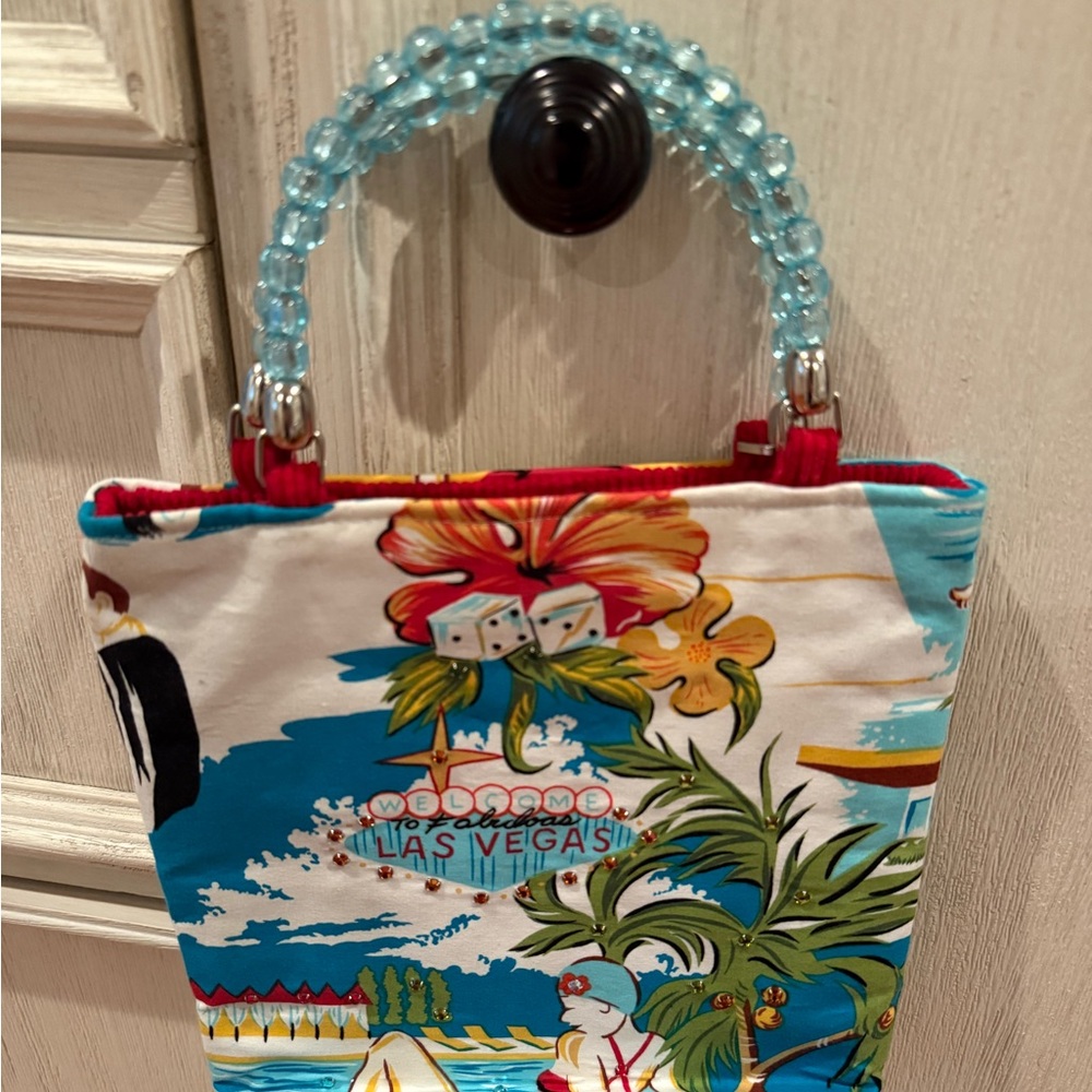 Gorgeous cloth, beaded handles and some rhinestones handbag. Never used.